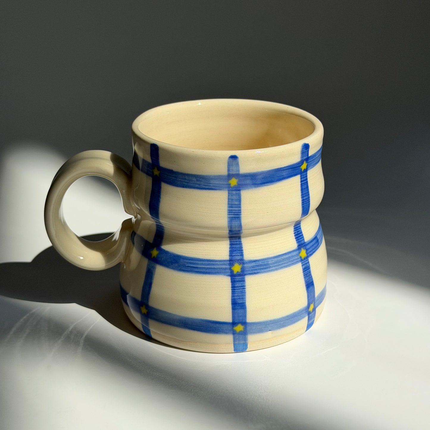 blue grid + star mug *TWO NOTES*